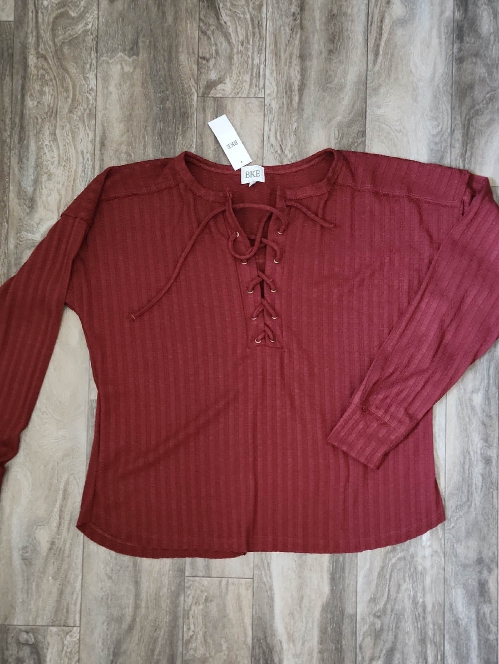 BKE Lace-Up Ribbed Long Sleeve Top in Burgundy Red